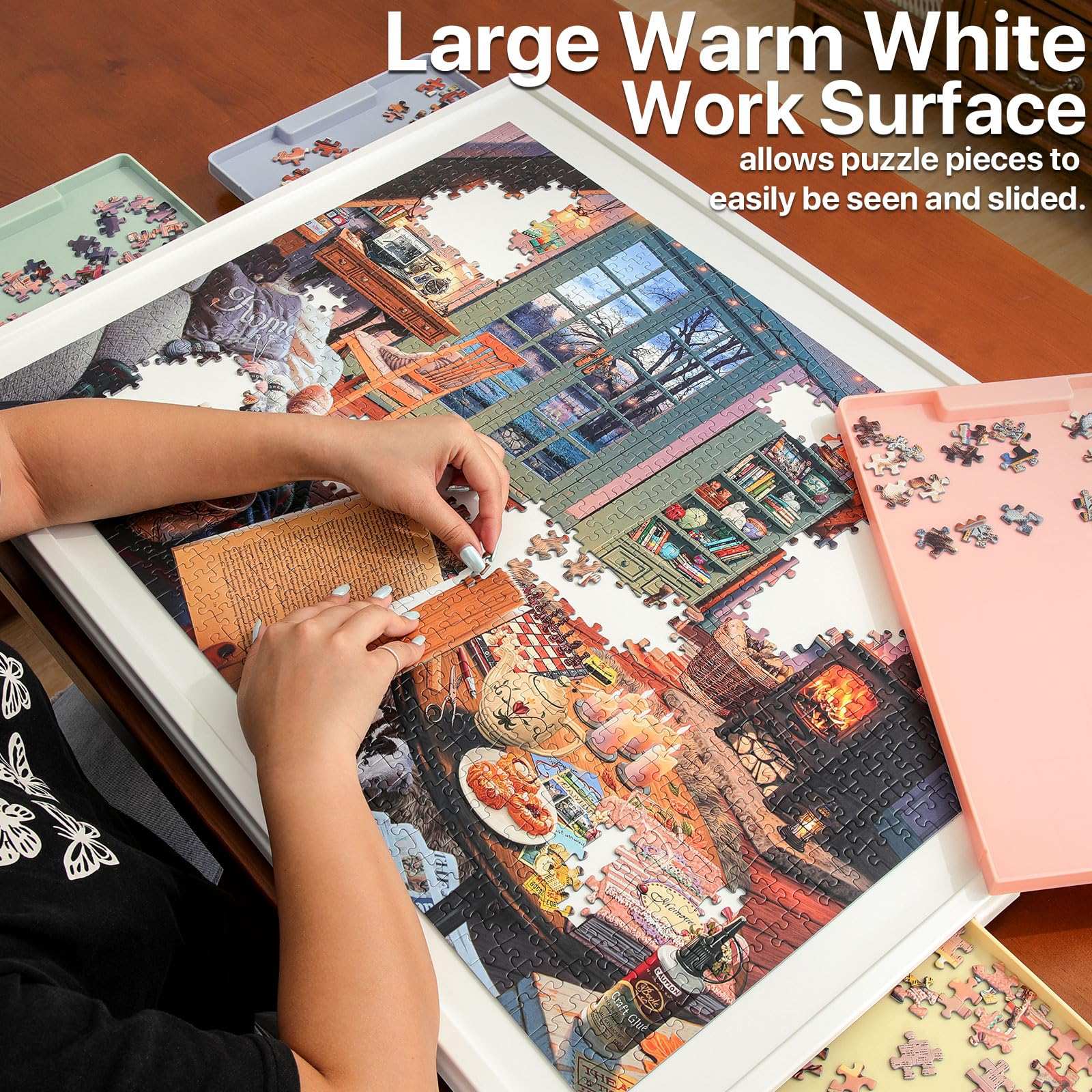 adult assembling puzzle on rotating white puzzle board with rainbow drawers