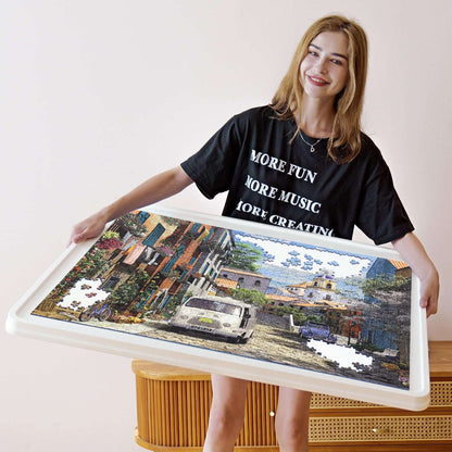 lightweight 1500 piece puzzle board held by smiling woman, showing portable design